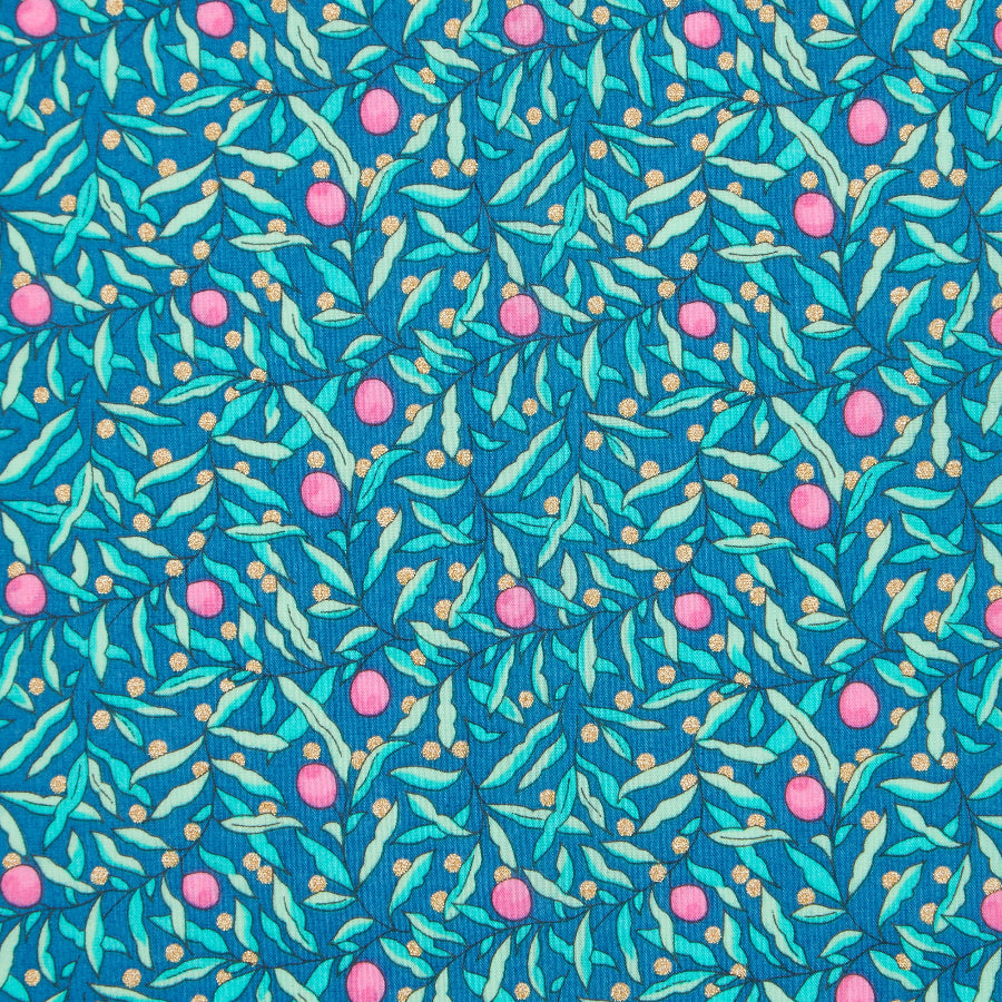 Cotton fabric with a pattern of pink flowers and green leaves on a blue background