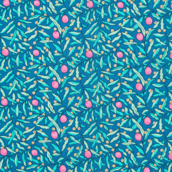 Cotton fabric with a pattern of pink flowers and green leaves on a blue background