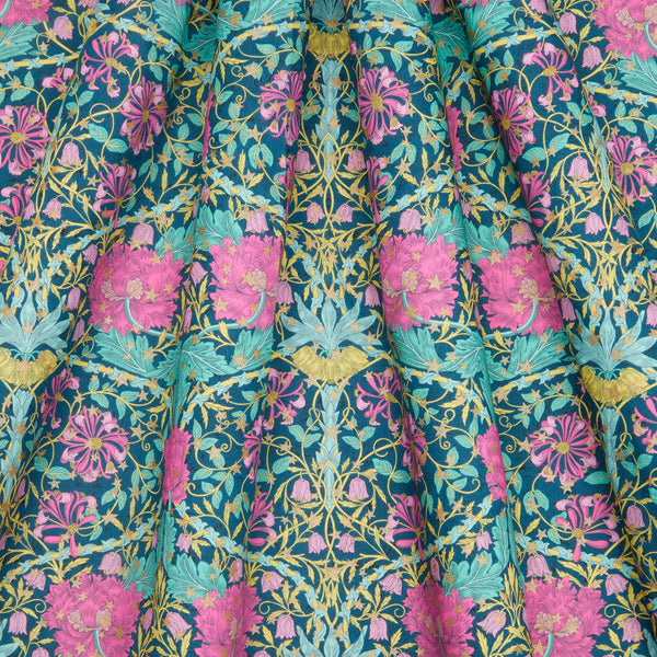 Floral fabric with pink and teal flowers on a blue background Liberty Fabric Christmas 2025 March Sparkle