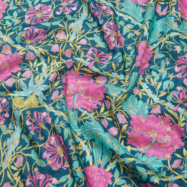 Floral fabric with pink and teal flowers on a blue background Liberty Fabric Christmas 2025 March Sparkle