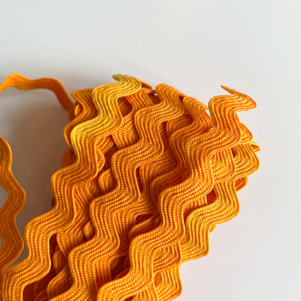 5-1/2 yard Remnant : Rick Rack - Tangerine (sun damaged)