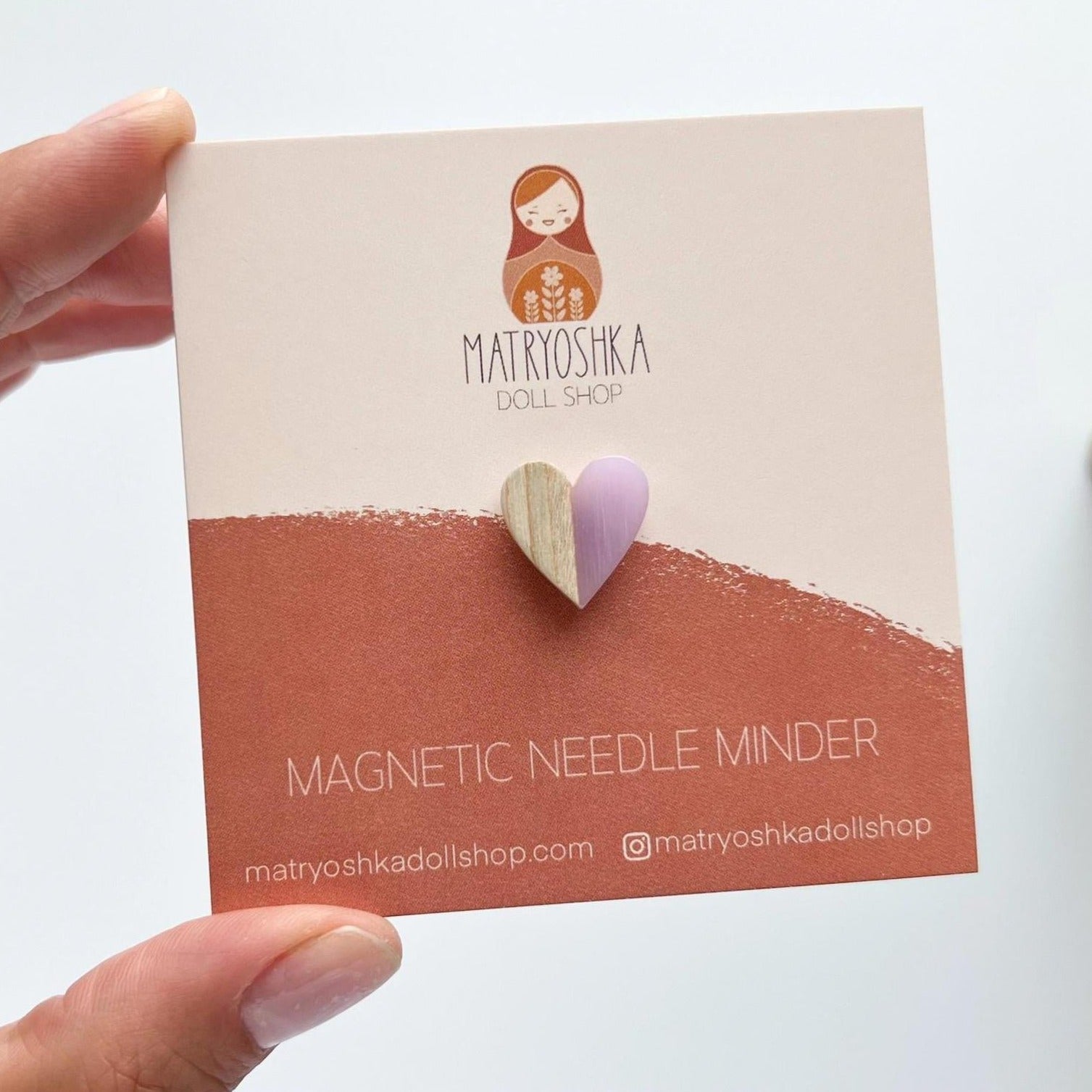 heart-shaped wooden magnetic needle minder