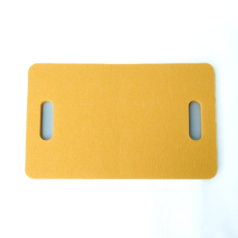 Yellow rectangular mat with cutout handles on a white background