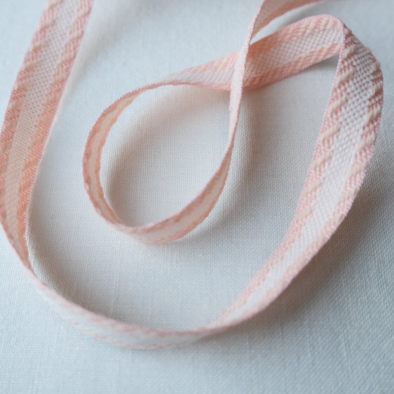 woven pink and white jacquard ribbon