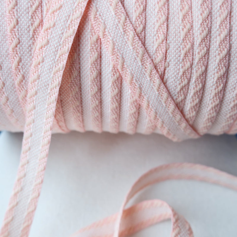 woven pink and white jacquard ribbon