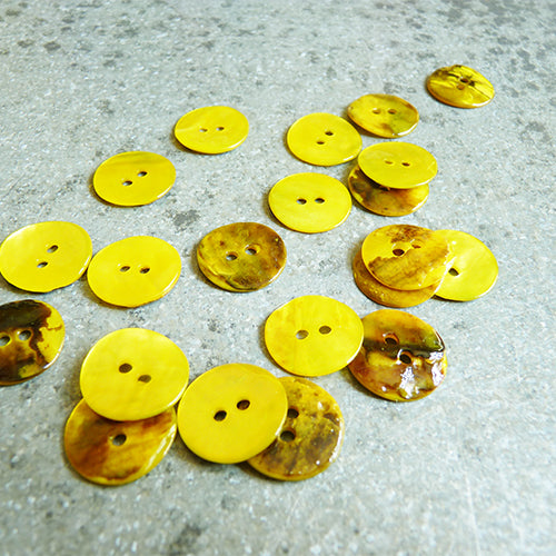 yellow shell buttons