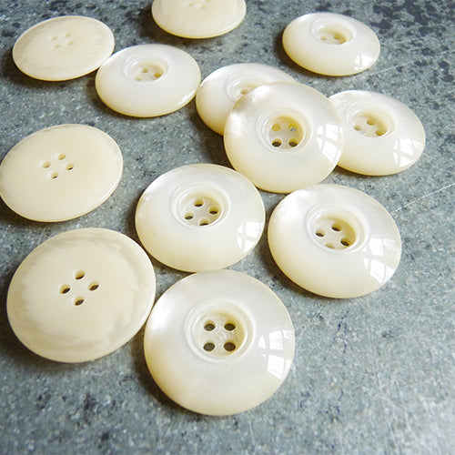 four hole pearly ivory domed plastic button